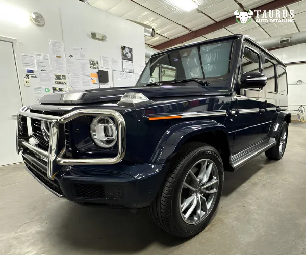 view of the polished vehicle displaying a high-gloss, protective finish under garage studio lighting, referencing ceramic coating