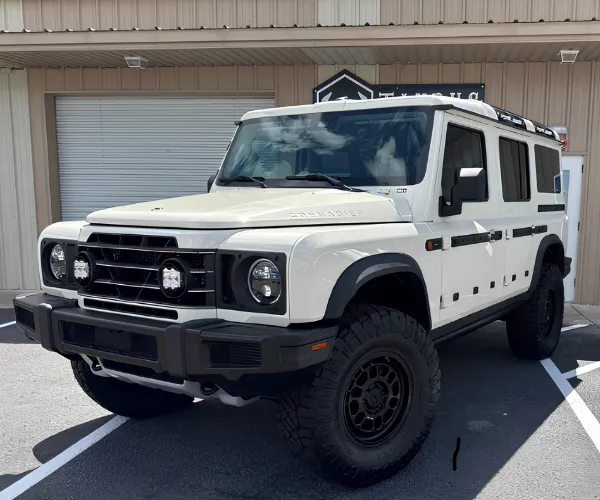 view of dark, professionally installed window tint on the side windows of a luxury vehicle