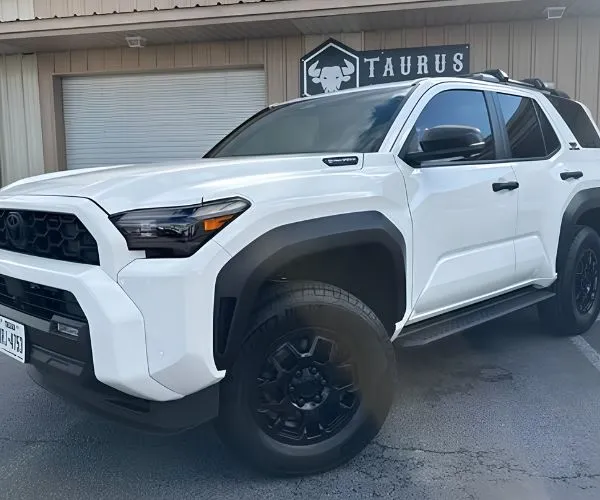 view of a white Toyota 4Runner SUV showcasing a clean paint finish